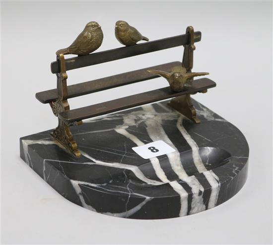 A Vide de Poche Art Deco bronze birds on a bench, on a marble base